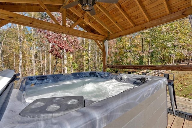 wooden deck with a hot tub