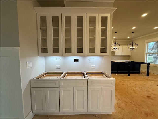 kitchen with decorative light fixtures, recessed lighting, glass insert cabinets, and white cabinets