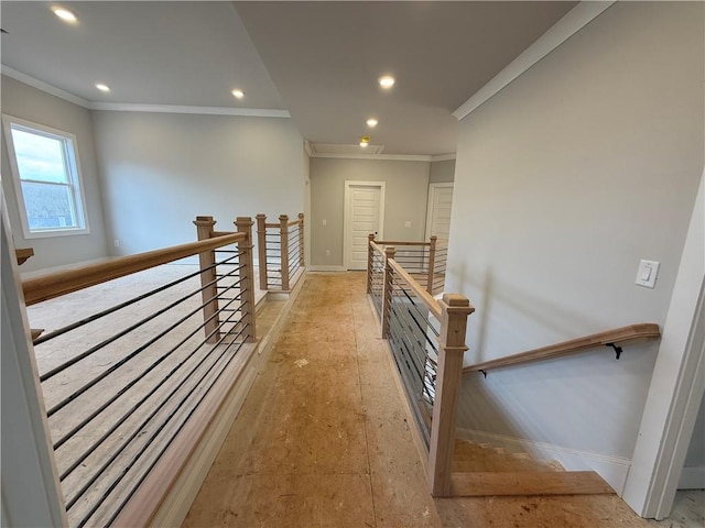 hall featuring recessed lighting, baseboards, crown molding, and an upstairs landing