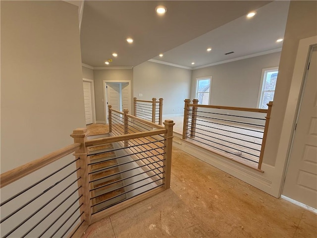 hallway featuring recessed lighting, crown molding, and an upstairs landing