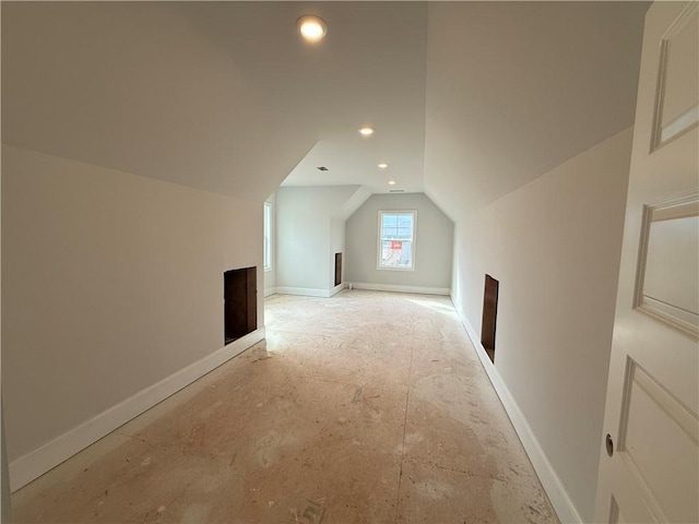 bonus room with lofted ceiling, baseboards, and recessed lighting