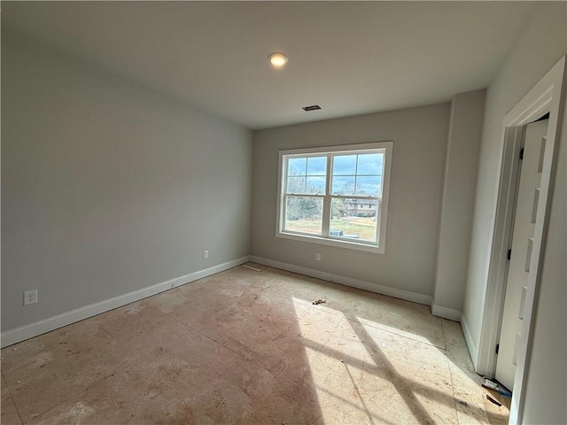 unfurnished bedroom featuring visible vents and baseboards