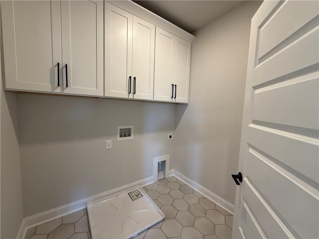 laundry area featuring cabinet space, hookup for an electric dryer, washer hookup, light tile patterned flooring, and baseboards