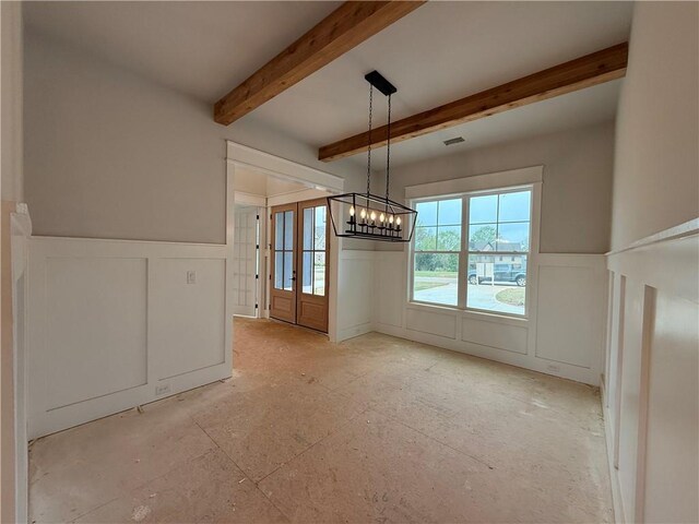 unfurnished living room featuring a fireplace, a notable chandelier, recessed lighting, ornamental molding, and baseboards