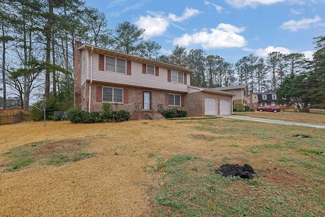 view of front of house with a garage and a front yard