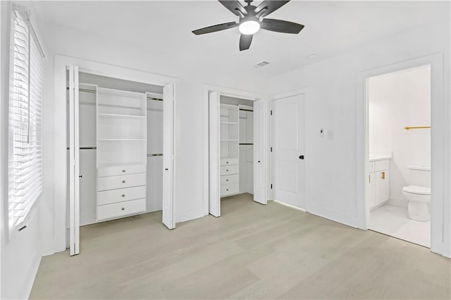 unfurnished bedroom with light hardwood / wood-style flooring, connected bathroom, and ceiling fan