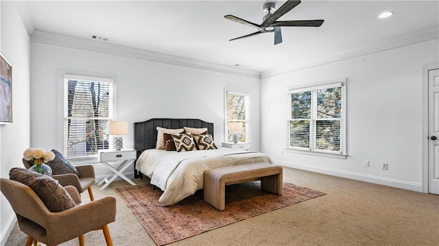 bedroom featuring multiple windows, carpet floors, and ornamental molding