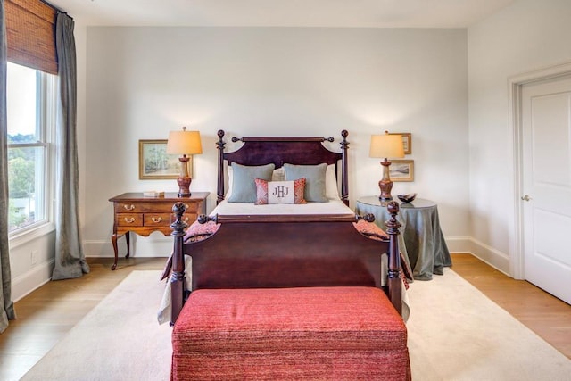 bedroom with light hardwood / wood-style floors