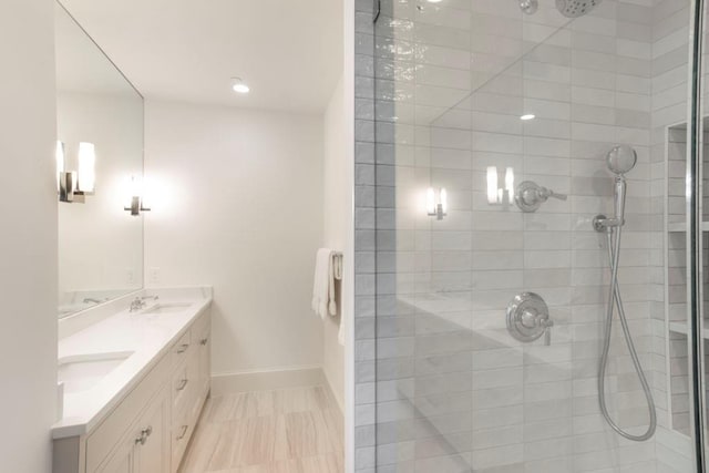 bathroom featuring vanity and a tile shower