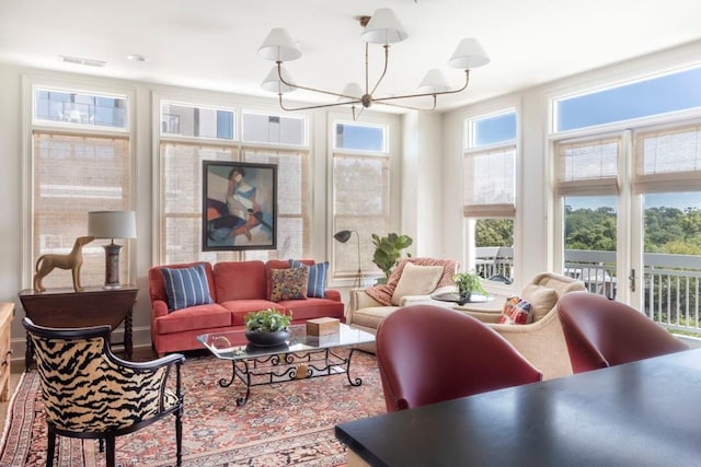 living room featuring an inviting chandelier