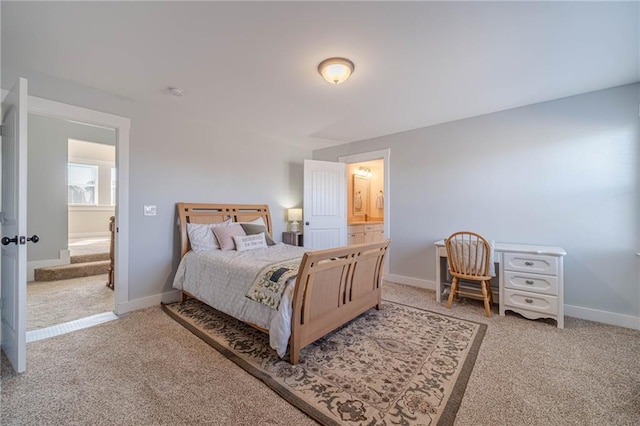 bedroom with carpet and connected bathroom