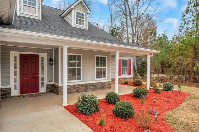 property entrance with covered porch