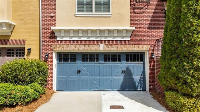 garage featuring driveway