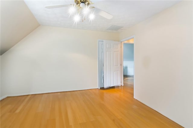 bonus room with hardwood / wood-style floors, ceiling fan, and lofted ceiling