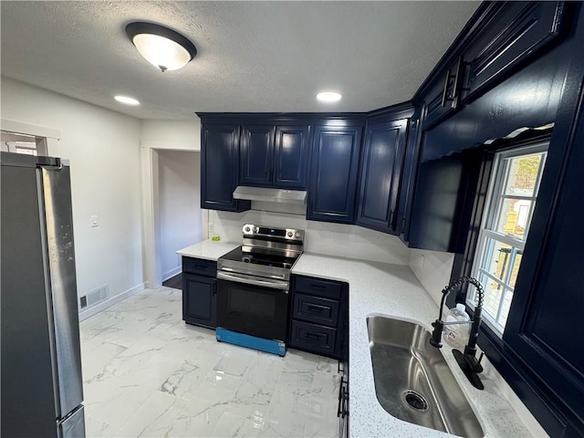 kitchen featuring marble finish floor, visible vents, appliances with stainless steel finishes, a sink, and under cabinet range hood