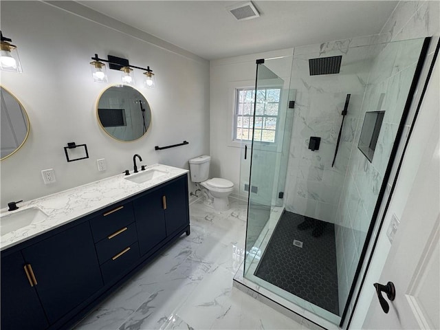 bathroom featuring marble finish floor, visible vents, a sink, and double vanity