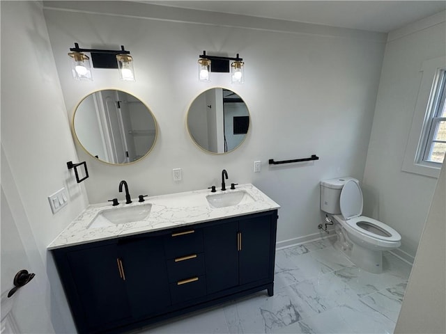 full bath with marble finish floor, a sink, baseboards, and double vanity