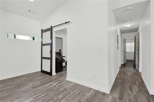 1048 Indian Hills Pkwy, Marietta, GA 30068 - corridor featuring attic access, wood finished floors, a barn door, and baseboards