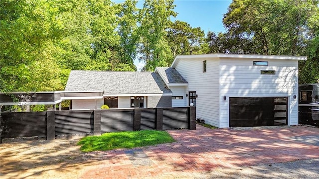 1048 Indian Hills Pkwy, Marietta, GA 30068 - view of front of property with a fenced front yard, a garage, and decorative driveway