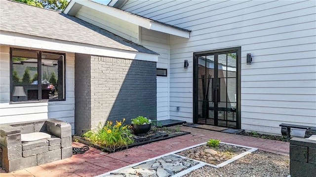 1048 Indian Hills Pkwy, Marietta, GA 30068 - entrance to property featuring brick siding, a patio, and roof with shingles