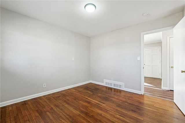 spare room with hardwood / wood-style floors