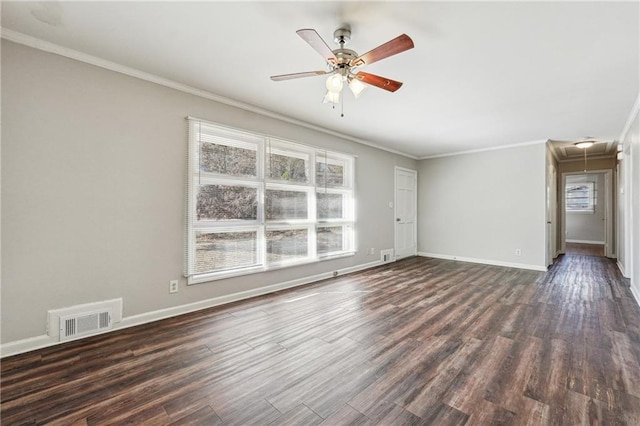 unfurnished living room featuring ceiling fan, a healthy amount of sunlight, dark hardwood / wood-style flooring, and crown molding