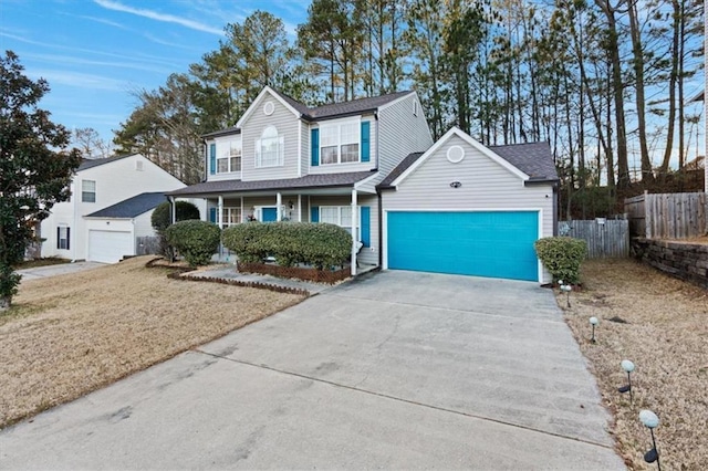 view of front property featuring a garage and a front lawn