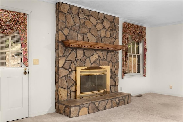 room details featuring a fireplace, carpet floors, and crown molding