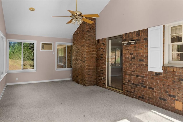 unfurnished sunroom with a wall mounted air conditioner, ceiling fan, and lofted ceiling