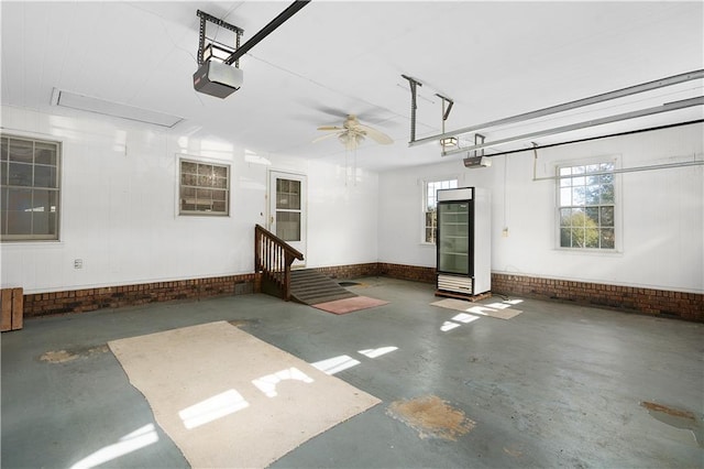 garage with ceiling fan and a garage door opener