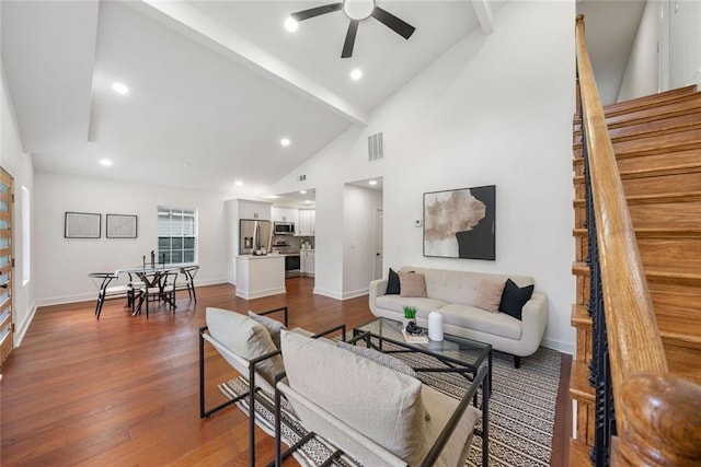 2822 Waters Rd SW, Atlanta, GA 30354 - living area with a ceiling fan, beamed ceiling, stairs, dark wood-type flooring, and high vaulted ceiling