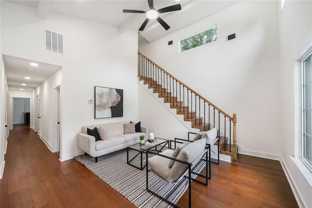 2822 Waters Rd SW, Atlanta, GA 30354 - living area with a high ceiling, stairs, wood finished floors, a ceiling fan, and baseboards