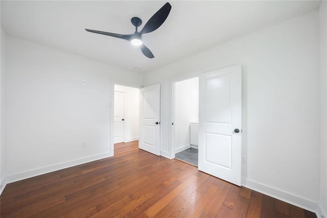 2822 Waters Rd SW, Atlanta, GA 30354 - unfurnished bedroom with wood finished floors, baseboards, and a ceiling fan