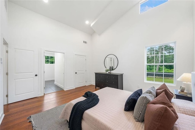2822 Waters Rd SW, Atlanta, GA 30354 - bedroom with high vaulted ceiling, wood finished floors, baseboards, and recessed lighting