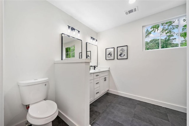 2822 Waters Rd SW, Atlanta, GA 30354 - bathroom featuring vanity, toilet, and baseboards