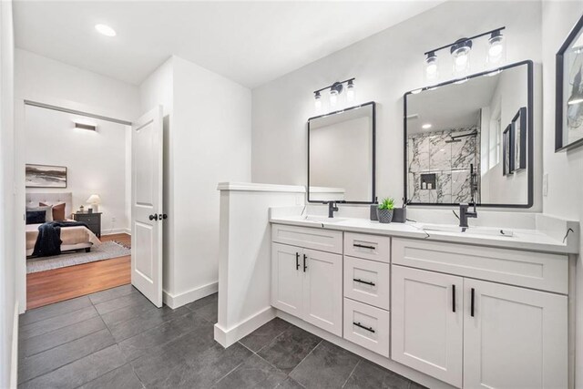 2822 Waters Rd SW, Atlanta, GA 30354 - ensuite bathroom featuring double vanity, tile patterned floors, a shower, baseboards, and recessed lighting