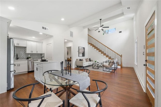 2822 Waters Rd SW, Atlanta, GA 30354 - dining room with lofted ceiling, dark wood-type flooring, a ceiling fan, stairway, and recessed lighting