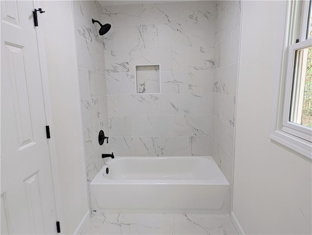 full bathroom featuring baseboards, marble finish floor, and shower / bathing tub combination
