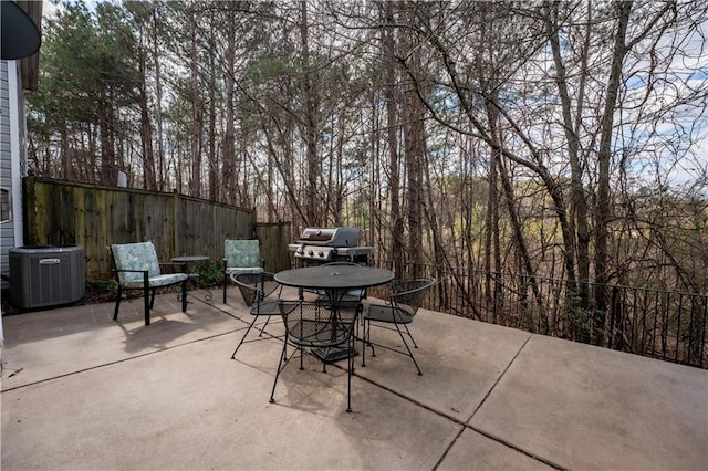 view of patio / terrace with a grill and central air condition unit