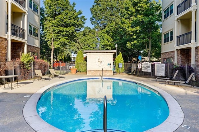 view of swimming pool featuring a patio