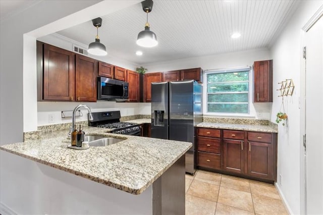 kitchen featuring black appliances, pendant lighting, kitchen peninsula, and sink