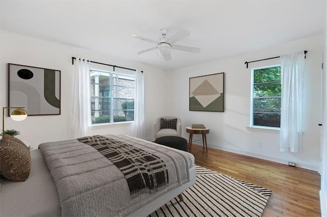 bedroom featuring ceiling fan and wood-type flooring