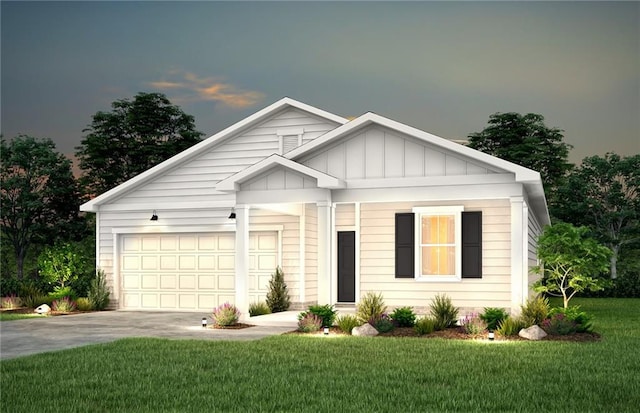 view of front of house with a garage and a lawn