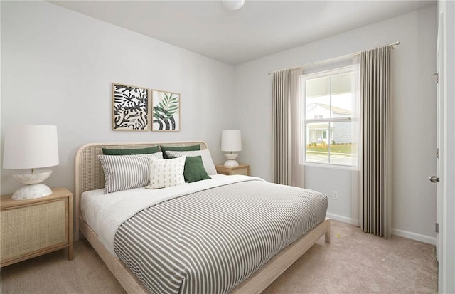 bedroom featuring light colored carpet