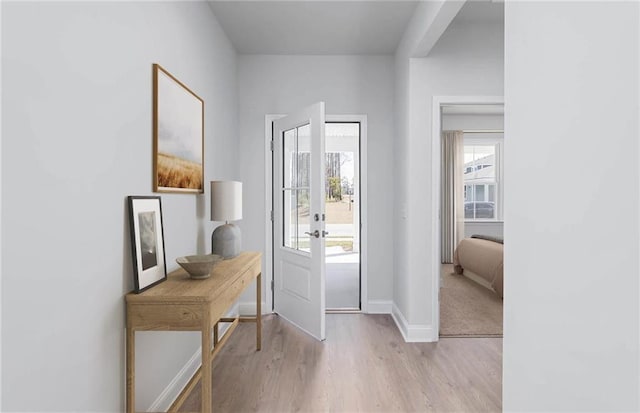 foyer entrance with light hardwood / wood-style flooring