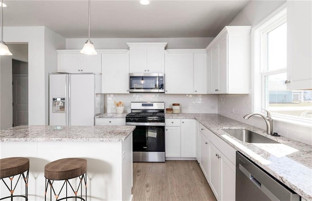 kitchen featuring appliances with stainless steel finishes and white cabinets