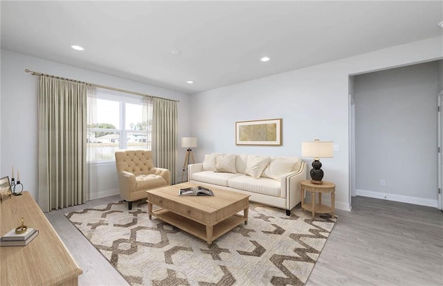 living room with light hardwood / wood-style flooring