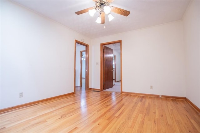 unfurnished room with light hardwood / wood-style flooring and ceiling fan