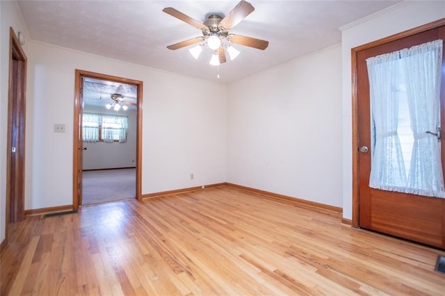 foyer with ceiling fan and light hardwood / wood-style floors