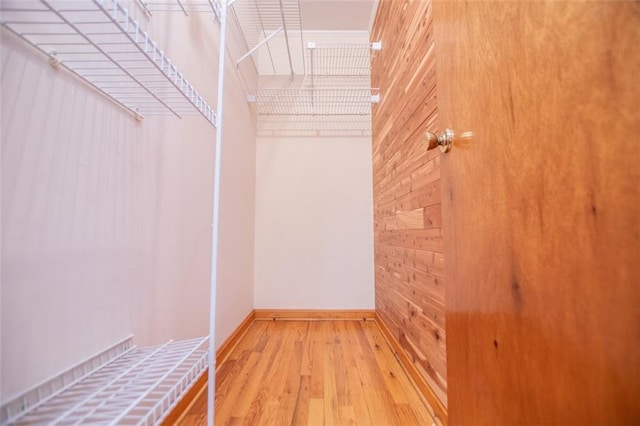 spacious closet featuring light hardwood / wood-style floors